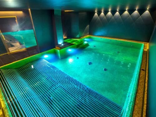 Large pool with hydro massage beds and water games